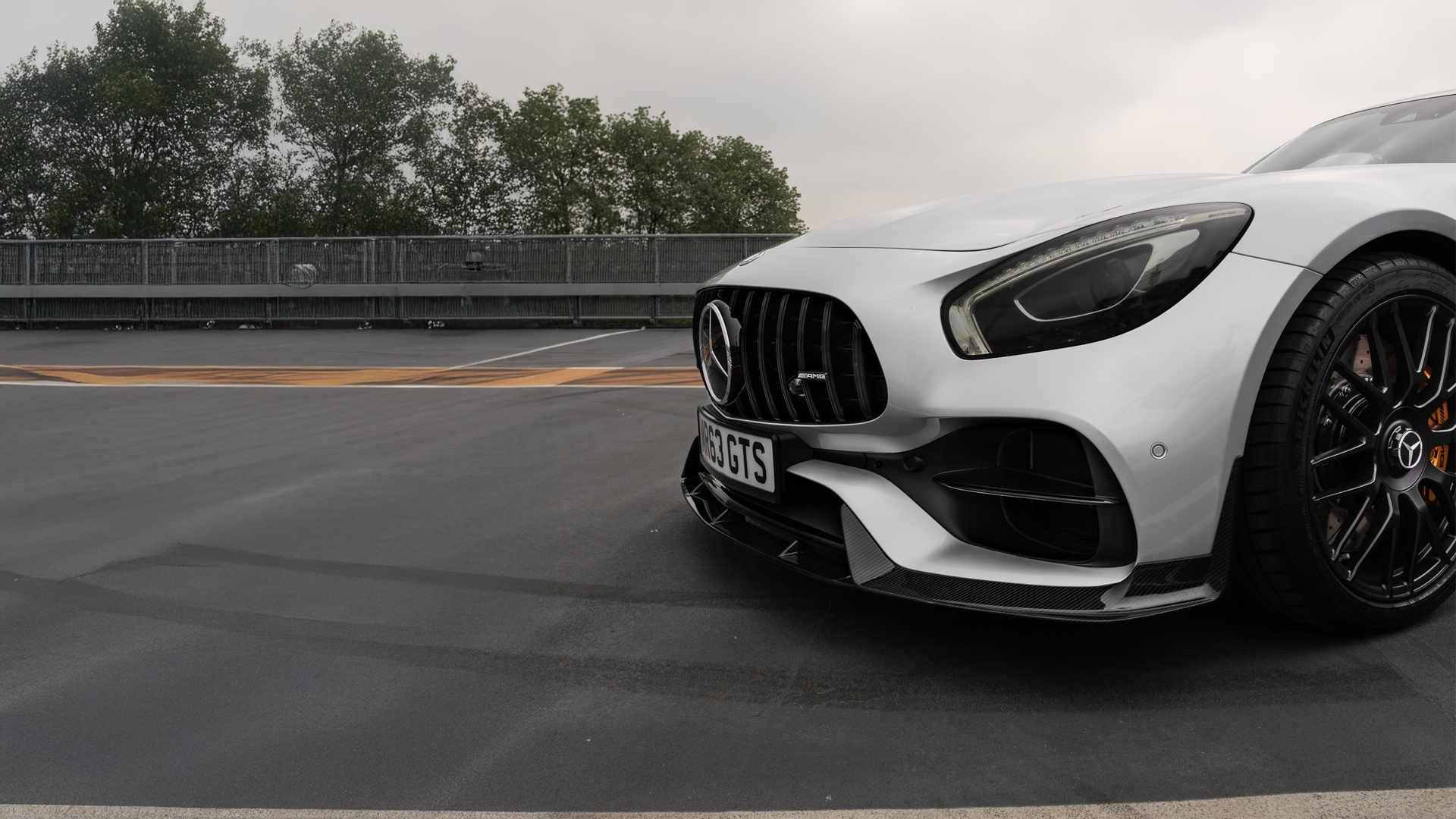 Close-up of White Mercedes-Benz logo