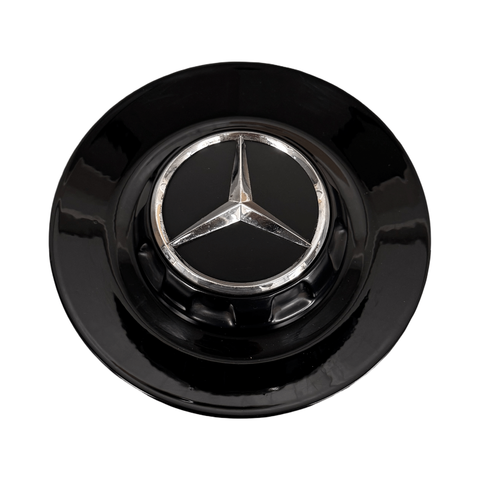 Close-up of Mercedes AMG wheel centre caps with chrome AMG logo